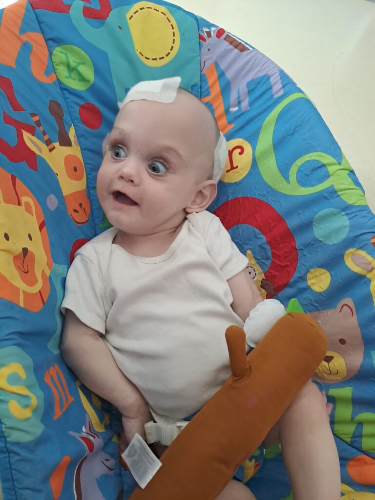 Baby boy in a bouncer